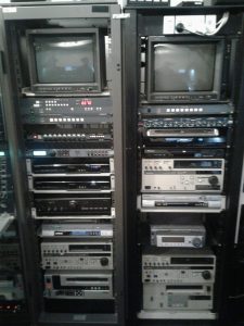 Video conversion suite populated with various VCR's and processing equipment