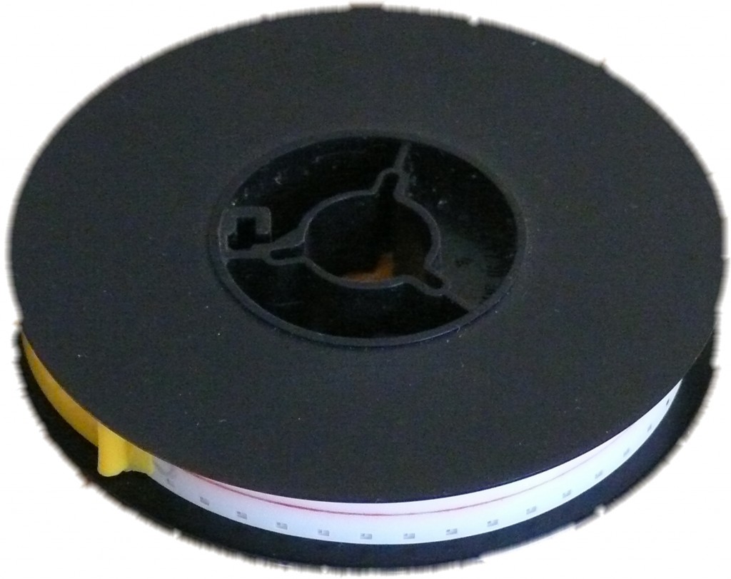 Super 8 film reel close up with white acetate leader