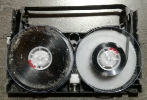 8mm cassette before cleaning with mould builup on reels