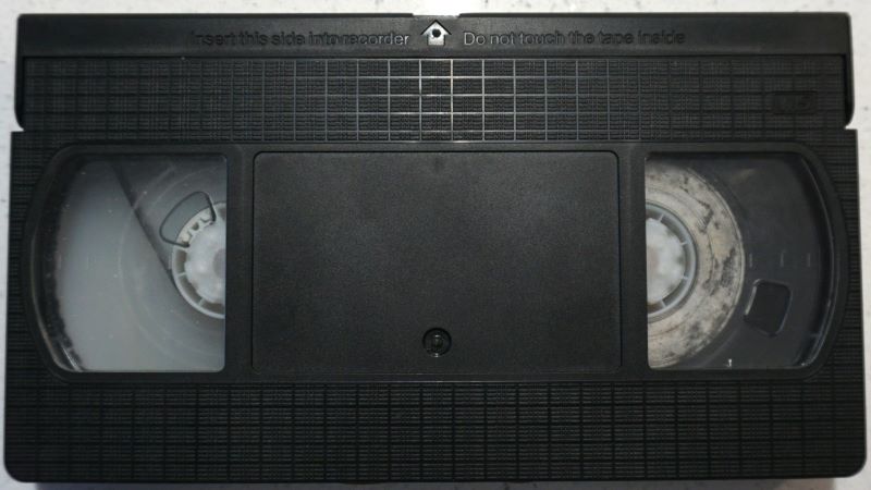 Dirty VHS tape midway through cleaning